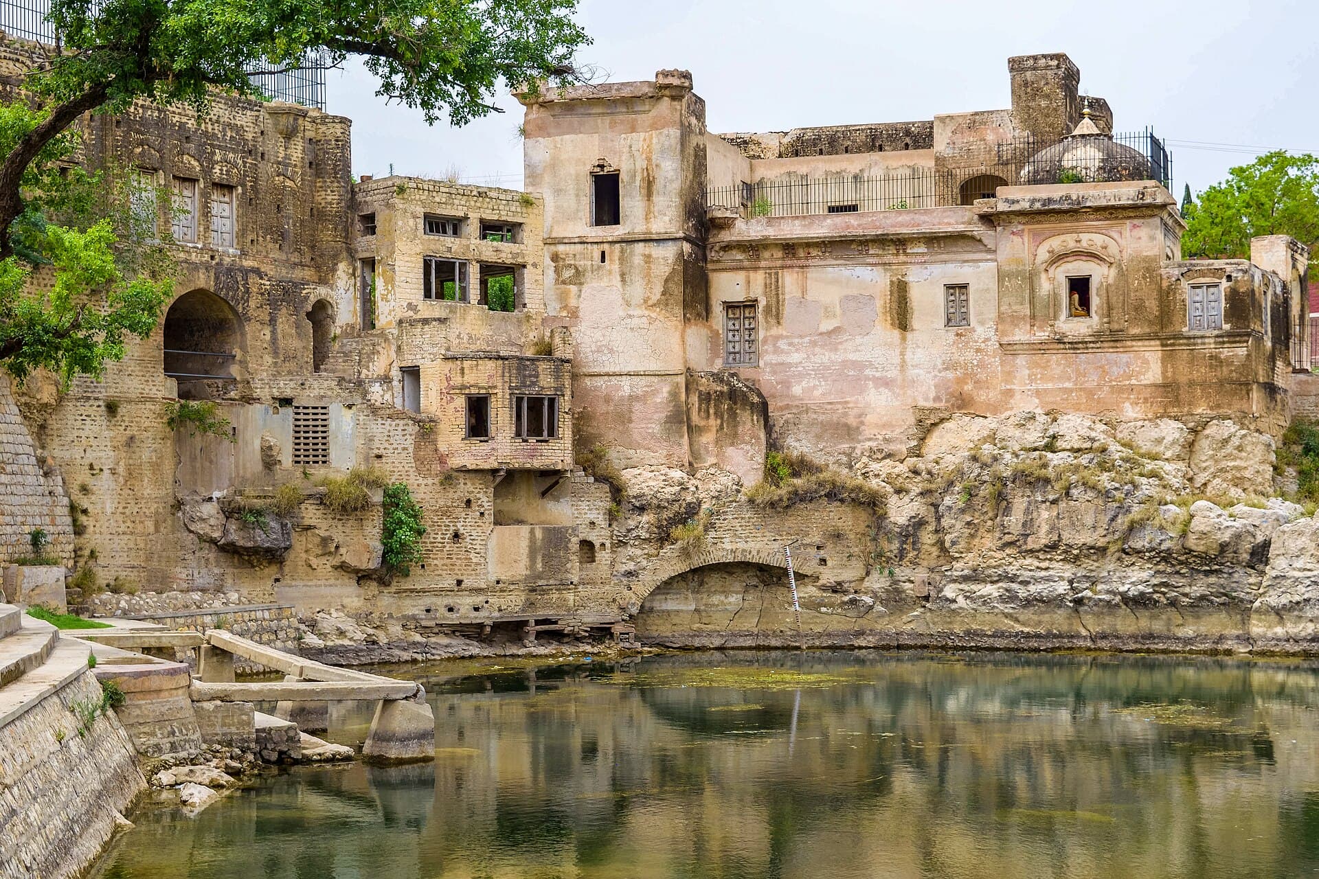 The temple buildings of Katas Raj stepped above the sacred pool