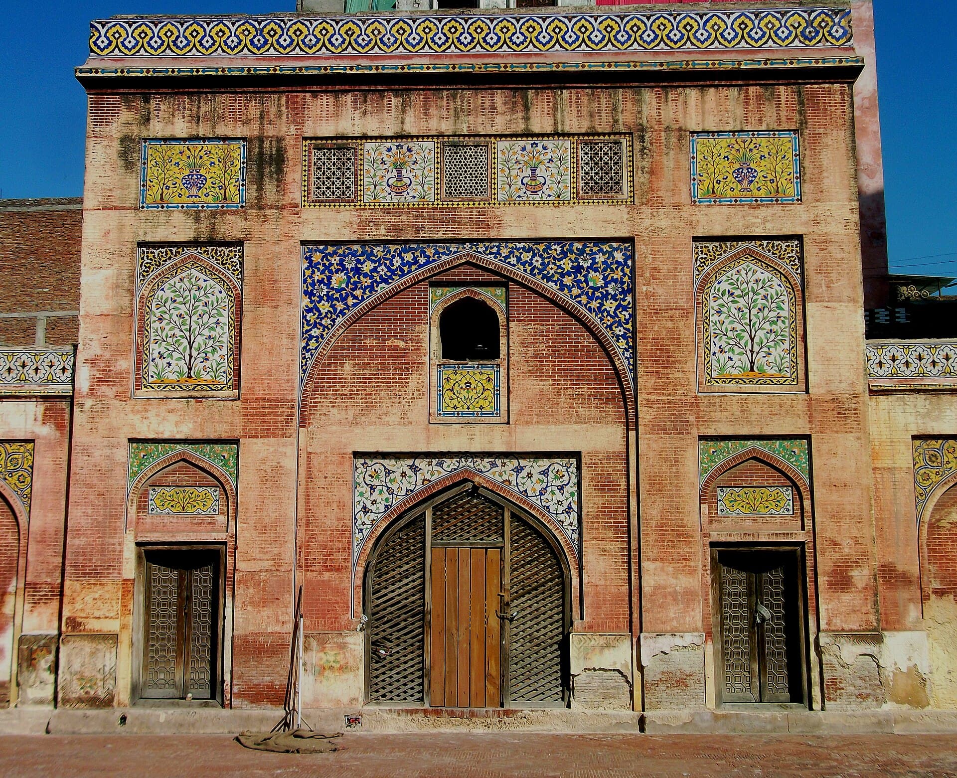 The tiled courtyard facade of the Wazir Khan Mosque in Lahore's Walled City