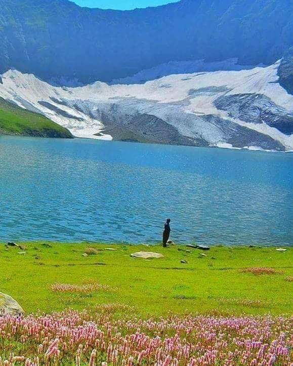 The lake itself, with the ridge behind it still holding snow in July.